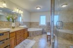 Master Suite bathroom with double vanity, walk in shower and soaking tub